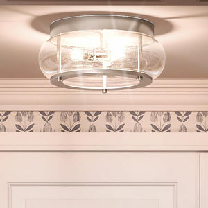 A unique lighting fixture, the Urban Ambiance UQL3300 Utilitarian Ceiling Light features a round glass shade.