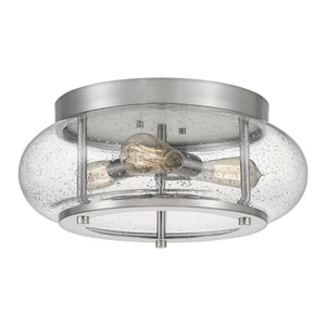 The UQL3300 Utilitarian Ceiling Light from Urban Ambiance’s Clearwater Collection features a brushed nickel finish, clear seeded glass shade, and three exposed bulbs inside—creating a stylish yet timeless modern farmhouse accent for any space.