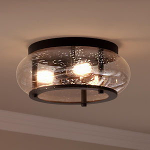 A beautiful UQL3301 Utilitarian Ceiling Light with a round glass shade.