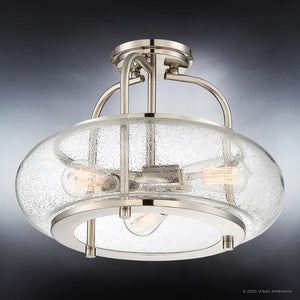 The UQL3310 Utilitarian Ceiling Light from Urban Ambiance’s Clearwater Collection features a brushed nickel finish, round textured seeded glass shade, and showcases three exposed bulbs in a modern design.