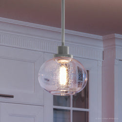 A stunning UQL3320 Utilitarian Pendant Light with a luxurious glass globe.
