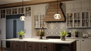 Modern kitchen with a white marble island, Urban Ambiance UQL3321 Utilitarian Pendant Lights, a patterned backsplash, dark appliances, and wooden accents.