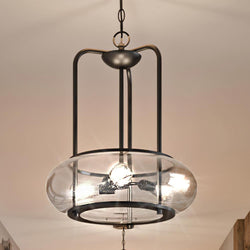 From the Clearwater Collection by Urban Ambiance, the UQL3341 Utilitarian Chandelier features a dark bronze finish and clear seedy glass, perfectly complemented by vintage-style bulbs.