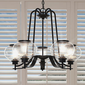 A unique UQL3371 Utilitarian Chandelier, 21.69"H x 26"W, with beautiful glass globes hanging over a window.