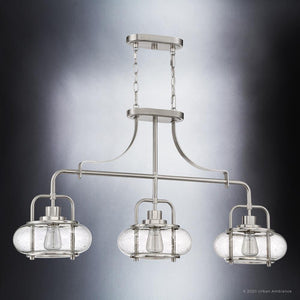 Three gorgeous lighting fixtures from the Urban Ambiance Clearwater Collection, featuring UQL3380 Utilitarian Chandeliers with glass shades.