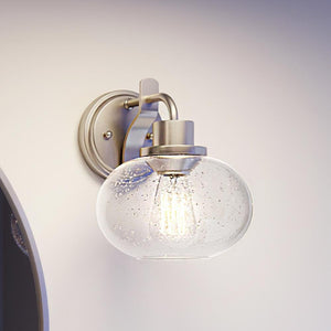 A UQL3391 Utilitarian Wall Light with a beautiful glass globe.