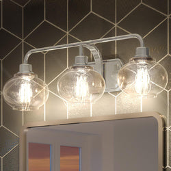 An Urban Ambiance bathroom vanity with three UQL3411 Utilitarian Bath Vanity Lights and a luxurious mirror.