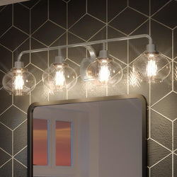 A bathroom with a UQL3421 Utilitarian Bath Vanity Light and a unique mirror.