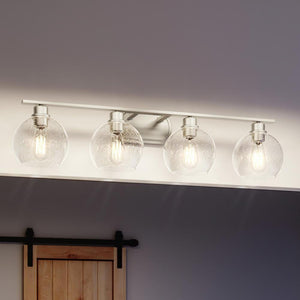 A beautiful Urban Ambiance bathroom light fixture with four UQL3450 Utilitarian Bath Vanity Light glass globes.