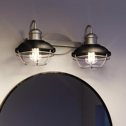 Two beautiful Urban Ambiance Davenport Collection pendant lights hanging over a mirror in a bathroom.
