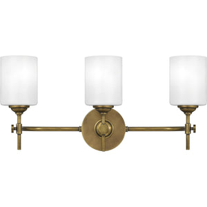 Three UQL3491 Mid-Century Modern Bath Vanity Light in brass with white shades from Urban Ambiance, creating a beautiful and luxurious ambiance.