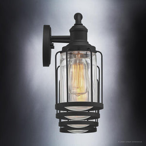 An Urban Ambiance luxury lighting fixture, the UQL3500 Industrial Chic Bath Vanity Light, adds a touch of elegance with its Natural Black Finish and clear glass bulb.