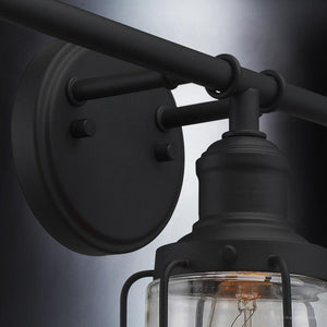 A luxury lighting fixture, the Urban Ambiance UQL3500 Industrial Chic Bath Vanity Light from the Hillsboro Collection features a gorgeous natural black finish and clear glass bulb.