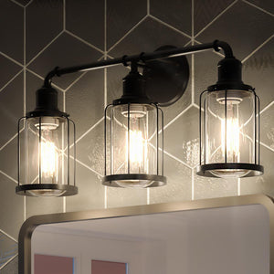 A luxury lighting fixture, the UQL3501 Industrial Chic Bath Vanity Lights, enhances the bathroom ambiance above a mirror.