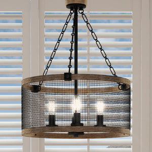 A unique UQL3622 Rustic Chandelier, 25.75"H x 18"W, with a Matte Black Finish is hanging over a window with shutters.