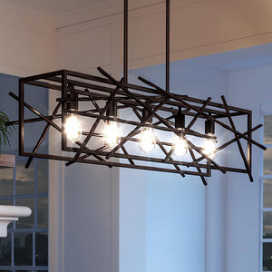 A UQL3130 Art Nouveau Chandelier, 12"H x 43.25"W, Restoration Bronze Finish from the Vallejo Collection by Urban Ambiance in a living room with a metal