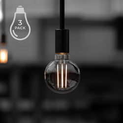A black and white photo of three UBB2101 Luxury LED Bulbs, 40W Equivalent, Vintage Edison Style, G16 Shape, E12 Base (candelabra base), 270