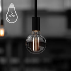 A beautiful and unique black and white photo of three Urban Ambiance UBB2102 Luxury LED Bulbs, 40W Equivalent.