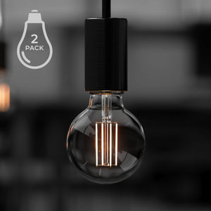 A black and white photo of two Urban Ambiance UBB2111 Luxury LED Bulbs, 60W Equivalent, Vintage Edison Style, G25 Shape, E26 Base (standard medium base).