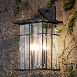 A unique Urban Ambiance outdoor wall light with ivy growing on it.