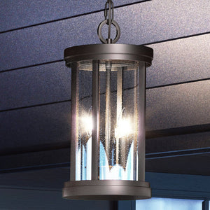 An Urban Ambiance UEX1043 Nautical Outdoor Pendant fixture hanging from the ceiling of a house, featuring a gorgeous Oil Rubbed Bronze Finish.