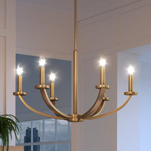 A beautiful UEX2012 New Traditional Chandelier 15''H x 26''W, Native Brass Finish hanging in a living room.