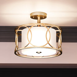 A Unique UEX2030 Cosmopolitan Ceiling Light 14''H x 16''W, Matte Gold Finish, Corvallis Collection by Urban Ambiance with a white shade.