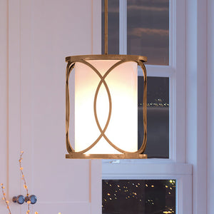 A beautiful Urban Ambiance light fixture, the UEX2034 Cosmopolitan Pendant 10''H x 10''W with a Matte Gold Finish from the Corvallis Collection, is hanging