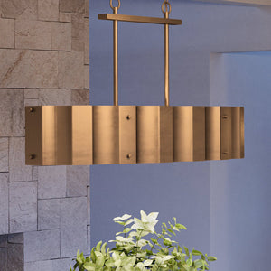A luxury lighting fixture, the Urban Ambiance UEX2048 Lux Industrial Chandelier 19''H x 37''W, Native Brass Finish from the Claremore Collection hangs over a
