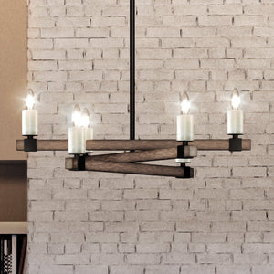 A Unique Urban Ambiance UEX2050 Modern Farmhouse Chandelier with four candles hanging from a brick wall.