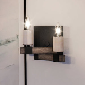 An Urban Ambiance UEX2051 Modern Farmhouse Wall Sconce 7''H x 9''W with two unique candles.