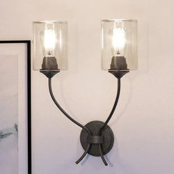 Two gorgeous UEX2061 Tuscan Wall Sconces hanging on a wall next to a picture.