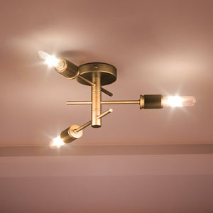 Three unique UEX2160 Mid-Century Modern Ceiling Light fixtures in a room with a gold ceiling.
