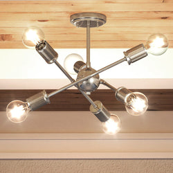 A beautiful and luxurious Mid-Century Modern ceiling light with five bulbs hanging from the ceiling.