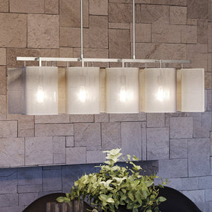 A unique modern chandelier, UEX2221, with a luxury Matte White & Polished Chrome Finish, from the Eastpointe Collection, hanging over a table with a plant on it