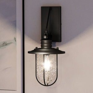 An Urban Ambiance UEX2281 Nautical Wall Sconce with a unique matte black finish and glass shade.