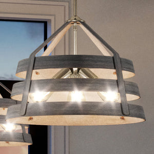 A modern farmhouse chandelier with a satin nickel finish in a room with a wooden ceiling.
