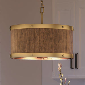 A unique UEX2306 Old World Chandelier with a gorgeous Satin Brass Finish, hanging over a kitchen island.