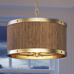 A beautiful Urban Ambiance UEX2307 Old World Chandelier 11''H x 25''W, Satin Brass Finish from the Portland Collection hanging over a window.