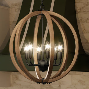 An Urban Ambiance UEX2343 Industrial Lux Chandelier hanging over a kitchen island, creating a beautiful ambiance.