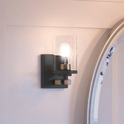 A luxury Urban Ambiance UEX2357 New Traditional Wall Sconce 9''H x 5''W, Charcoal & Olde Brass Finish, Elwood Collection with a unique glass