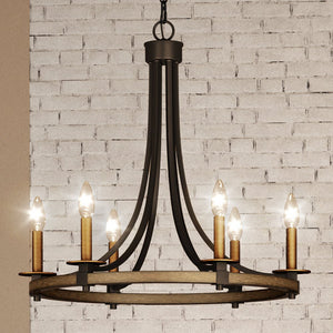 A beautiful UEX2380 Lux Industrial Chandelier 24''H x 24''W, Matte Black and Vintage Brass Finish with five candle lights in a brick wall.