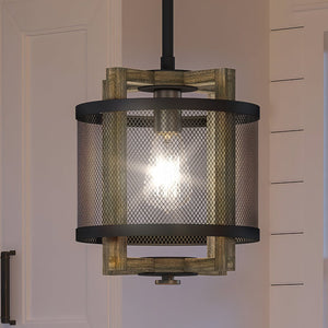 A UEX2385 Lux Industrial Pendant 12''H x 10''W, Matte Black and Vintage Brass Finish, Freeport Collection gorgeous lighting fixture hanging over a kitchen counter from Urban Ambiance