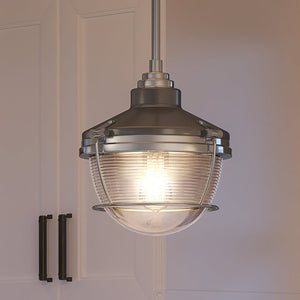 A gorgeous lamp from the Glenview Collection by Urban Ambiance is hanging over a kitchen island.