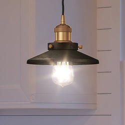 A unique and beautiful pendant light from the Sanford Collection by Urban Ambiance hanging in a kitchen.