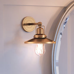 A luxury lighting fixture, the Urban Ambiance UEX2434 New Traditional Wall Sconce 7''H x 8''W, Satin Brass Finish from the Sanford Collection is