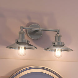 A luxury lighting fixture above a mirror in a bathroom, the UEX2445 New Traditional Bath Light 8''H x 18''W from the Sanford Collection features a unique Satin