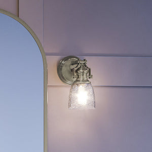 An Urban Ambiance UEX2453 New Traditional Wall Sconce with a unique mirror, featuring a Satin Nickel Finish from the Winsted Collection.
