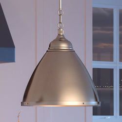 A beautiful and unique UEX2470 Lux Industrial Pendant 16''H x 15''W, Brushed Steel Finish, Waterford Collection hanging over a kitchen island by Urban Ambiance.