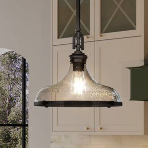 A beautiful New Traditional Pendant hanging over a kitchen island.